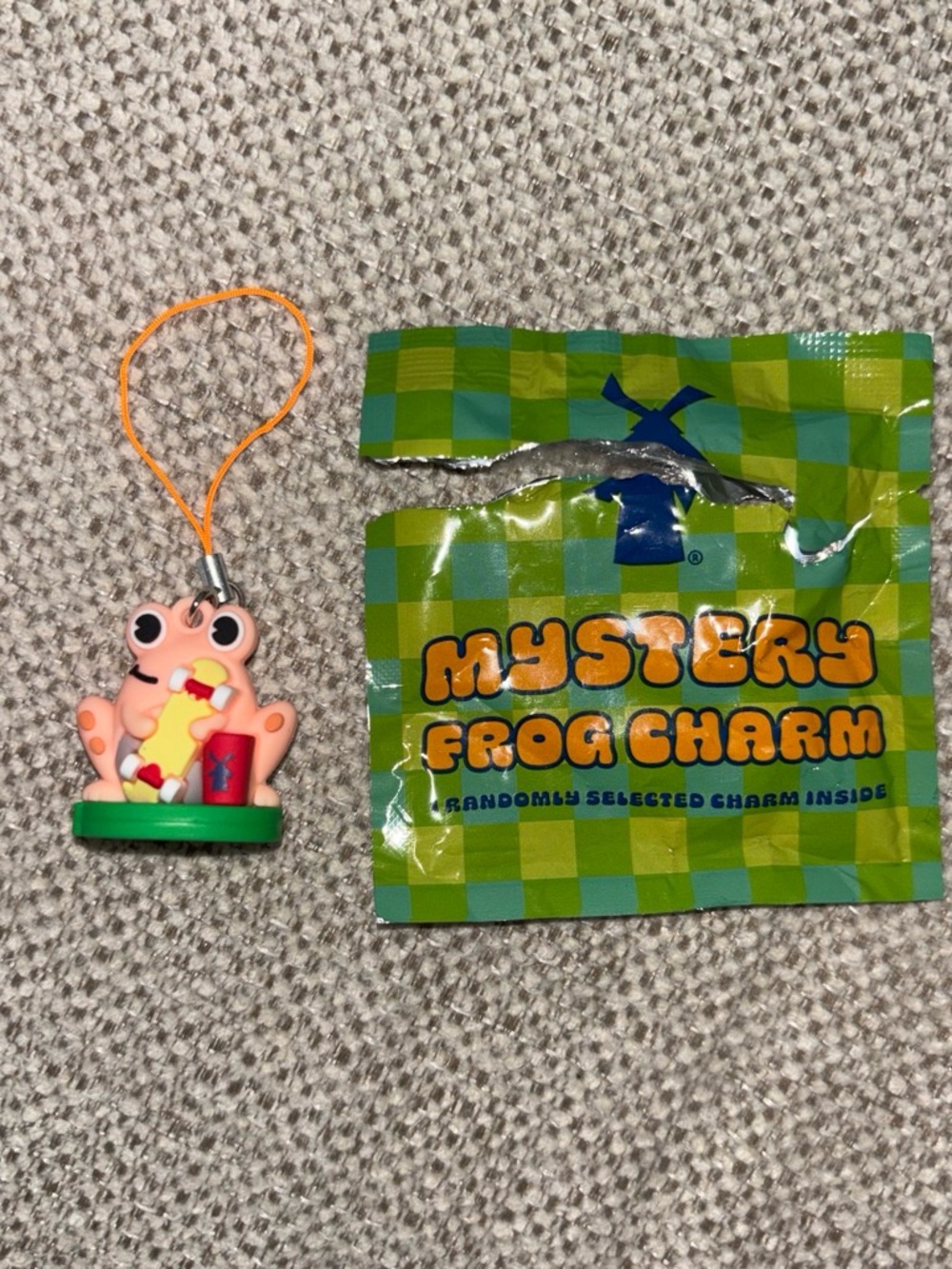 Dutch Bros Pink Frog Charm Phone Strap with Green Base and Orange Cord